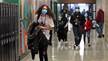 Students walk to class through once-crowded hallways at Brockton High School in Brockton, Massachusetts, in March 2021.