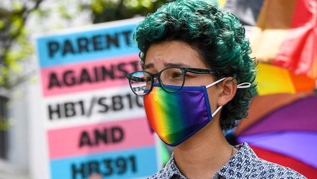 A picture containing text, person, outdoor

Description automatically generated