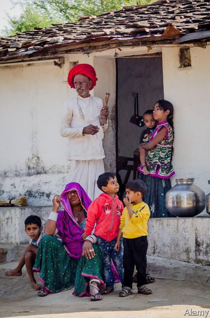 HPCBP2 RAJASTHAN, INDIA - NOVEMBER 20, 2016: Five young grandchildren with their elderly grandparents when their parent is at work.